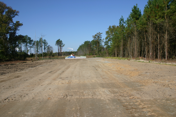 Road with bridge over 2nd Gut in background